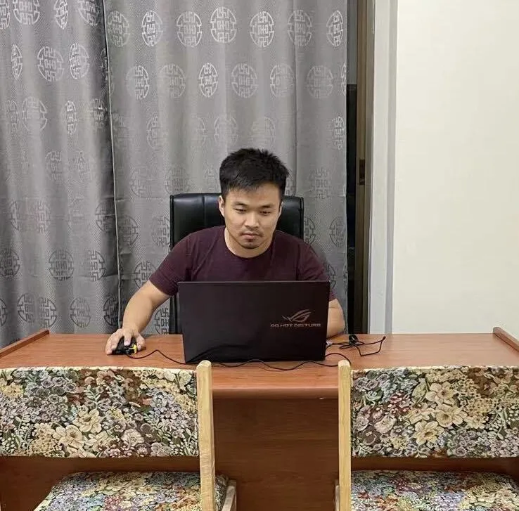 Desk with a laptop and a small globe